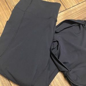Pureluxe by Fabletics leggings. Black. Ankle length with knot & opening.